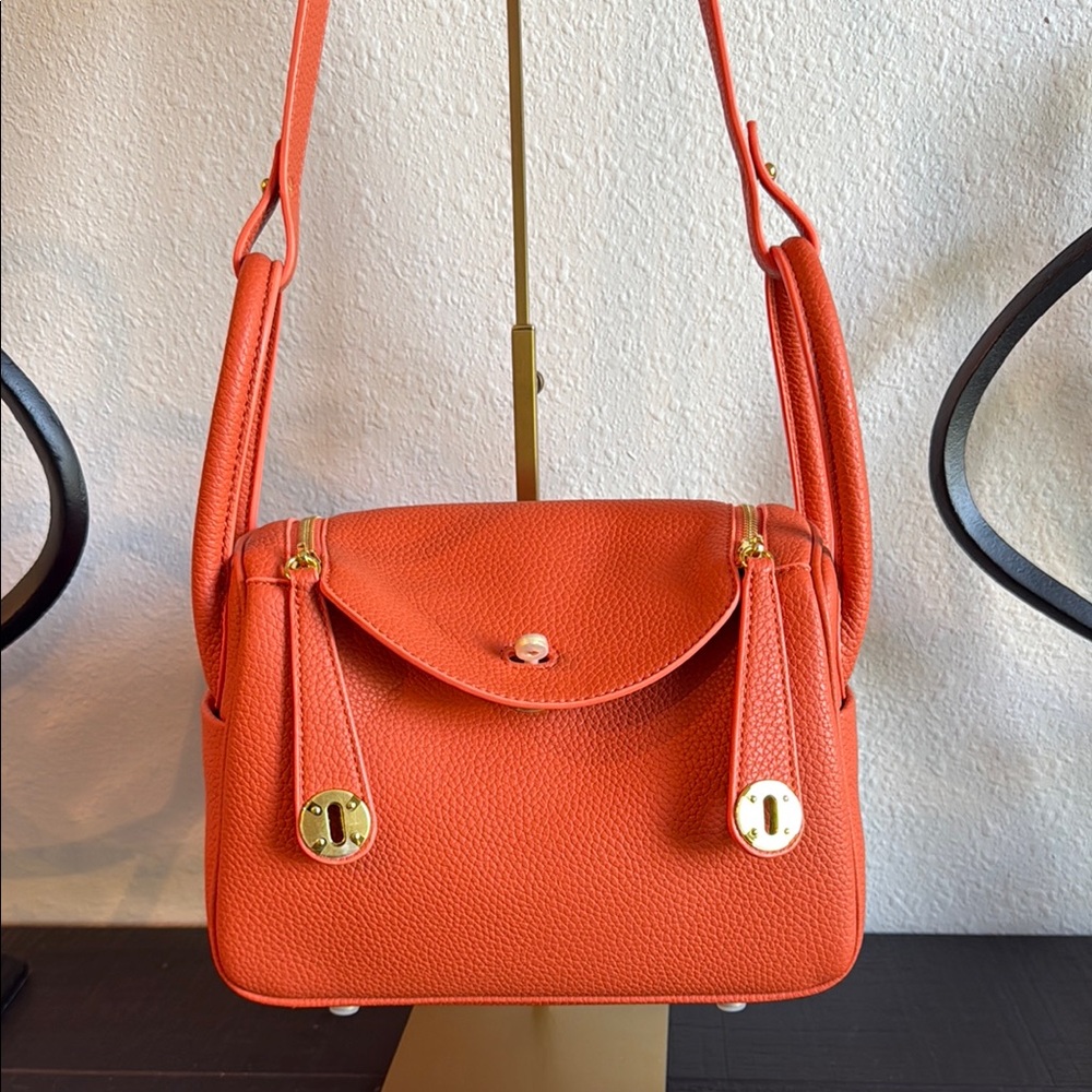 Vibrant Orange Shoulder Bag with Gold Accents